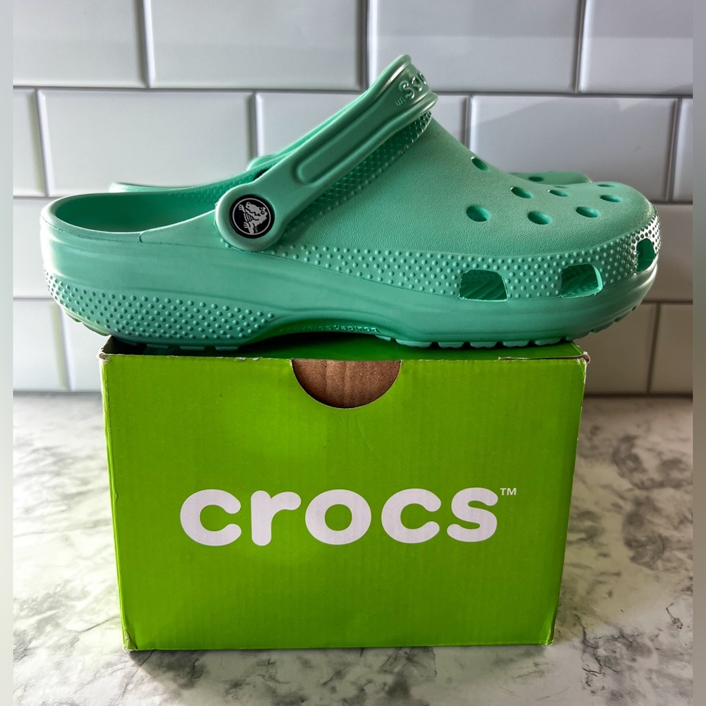 Teal Crocs M7 W9